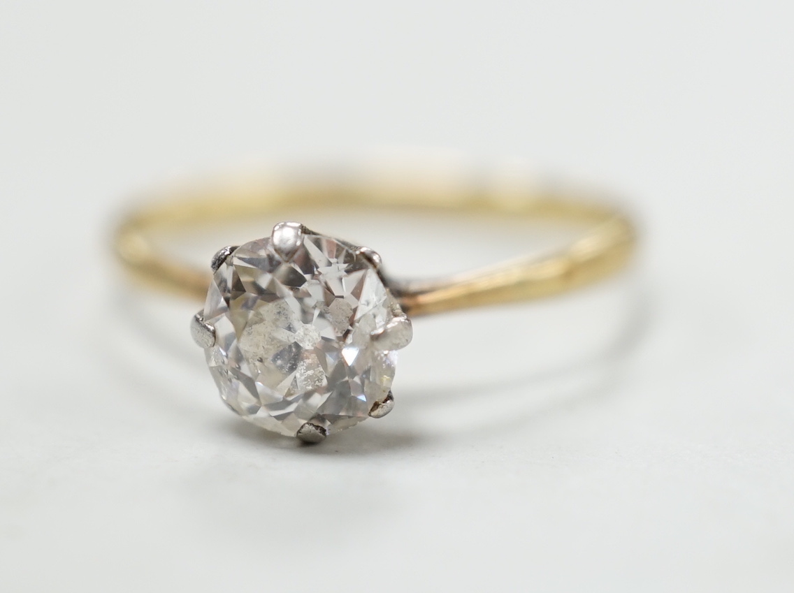 An 18ct, plat and solitaire diamond ring, size M/N, gross weight 1.8 grams, the stone measuring approx. 6.0mm by 5.2mm.